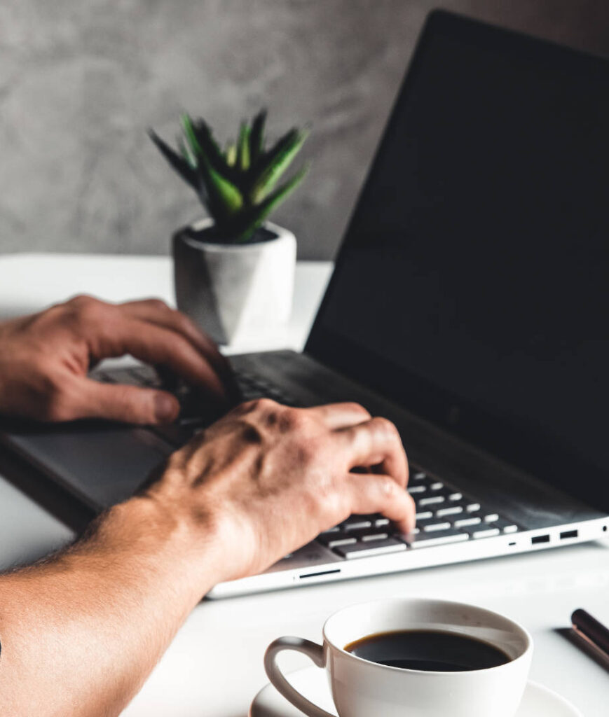 man typing on computer